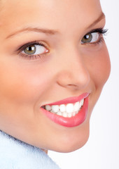 Sticker - Smiling  young woman face. Over white background.