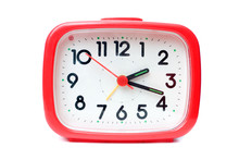 Old Red Alarm Clock On A White Background