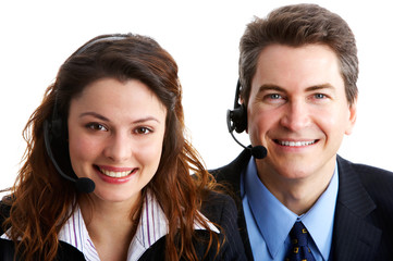 Poster - Smiling  business people  with headsets. Over white background .