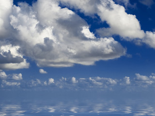 clouds looming over the horizon with deep blue sky in background
