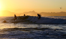 Four Surfers On One Wave