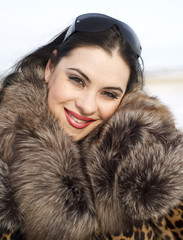 beauty woman in leopard fur coat