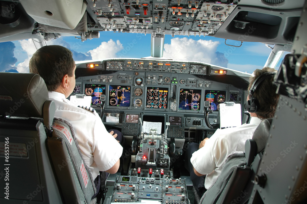 Pilots in the cockpit - obrazy, fototapety, plakaty 
