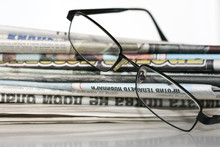 Newspapers And Glasses