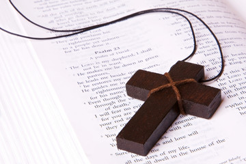 Cross lying inside the bible