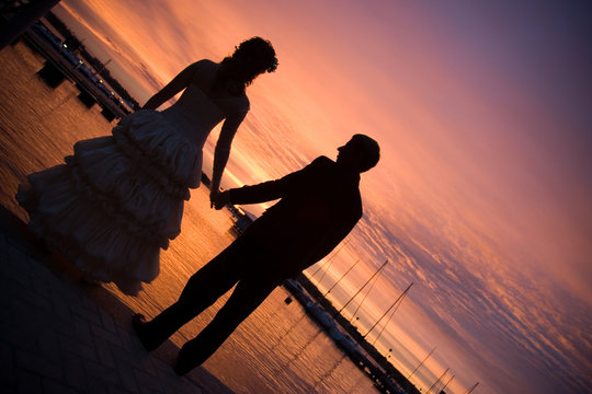 Couple wedding on the beach at sunset