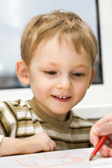 Wall Mural - Little boy studies to draw