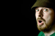 © dundanim - Closeup face of surprised shocked guy isolated on black