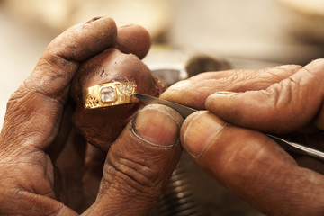 Jeweler making rings