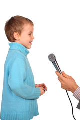 boy speaks into  microphone