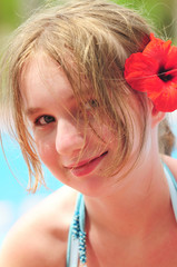 Poster - Portrait of a girl with red flower