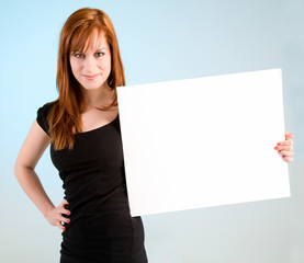 Young Redhead Woman Holding a Blank White Sign