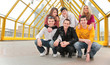 group of young people pose on footbridge