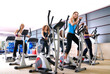 © .shock - Women working out on spinning bikes at the gym