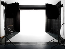 Empty Studio With Lights And White Background