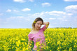 © Angel_a - Beautiful girl among blooming rape oilseed field