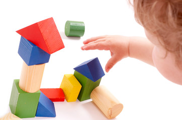 Child playing toys isolated on white