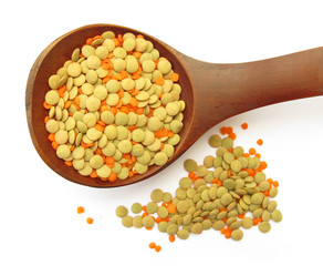 Lentil daal pulse mixed in wooden spoon