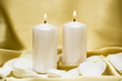 © VIKTORIIA KULISH - Candles with flower on golden background