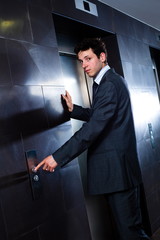 Canvas Print -   Businessman calling elevator