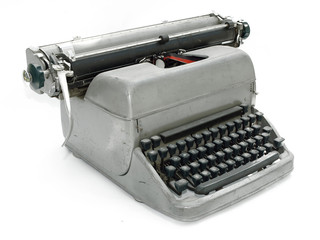 Vintage old type writer against a white background