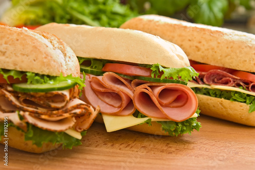 Obraz w ramie Ham sandwich, turkey sandwich and salami sandwich