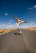 © Tandem - man on the road jumping