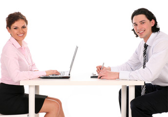 Businesswoman and businessman at desk