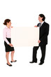 © pikselstock - Business people holding blank poster board