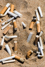 Cigarette Butt In Sand