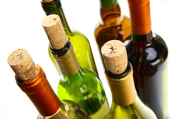 wine bottles with  corks on white