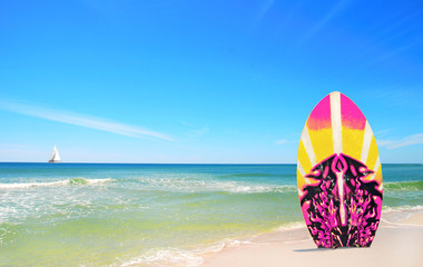 Wall Mural - Pink and Yellow Surf board at beach