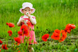 canvas print picture - Child with red flower