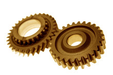 Two Gears Meshing Together Over White