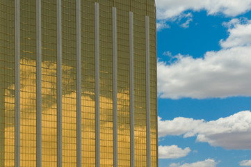 Wall Mural - golden skyscraper over blue sky