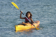Young Girl Learning To Kayaking