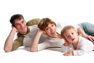 Happy family laying on a floor