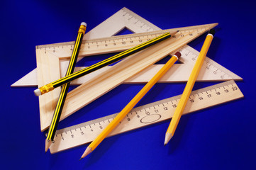 Measuring devices and a pencil  (on a dark blue background)