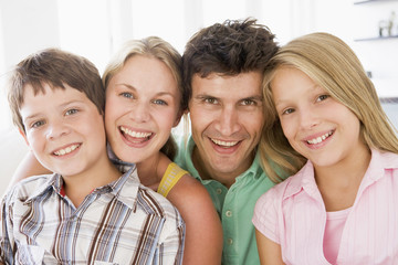 Family in living room smiling