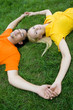 © pikselstock - Couple Lying on the Grass
