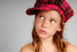 Young girl in plaid cap
