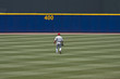 Baseball player walking to outfield