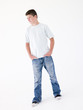 © Monkey Business - Teenage boy standing with hands in pockets