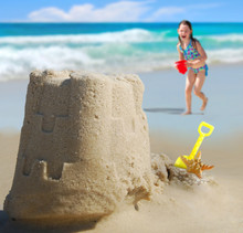 Happy Girl Running Towards Pretty Sand Castle