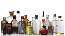 Old Pharmacist's Bottles And Beakers On White