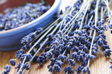 Fototapeta Lawenda - Bunch of dried lavender herb and lavender flowers in a bowl