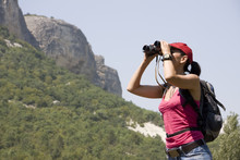 Woman With The Binoculars In The Mountains