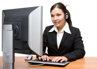 Canvas Print - attractive brunette woman in office with headphone