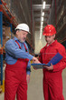 © endostock - two workers in uniforms in warehouse
