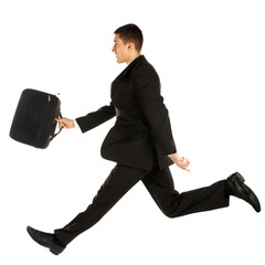 Wall Mural - jumping young manager in suit on white